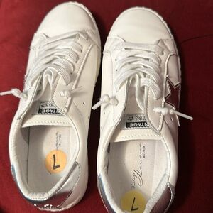 White leather converse style tennis shoes worn twive